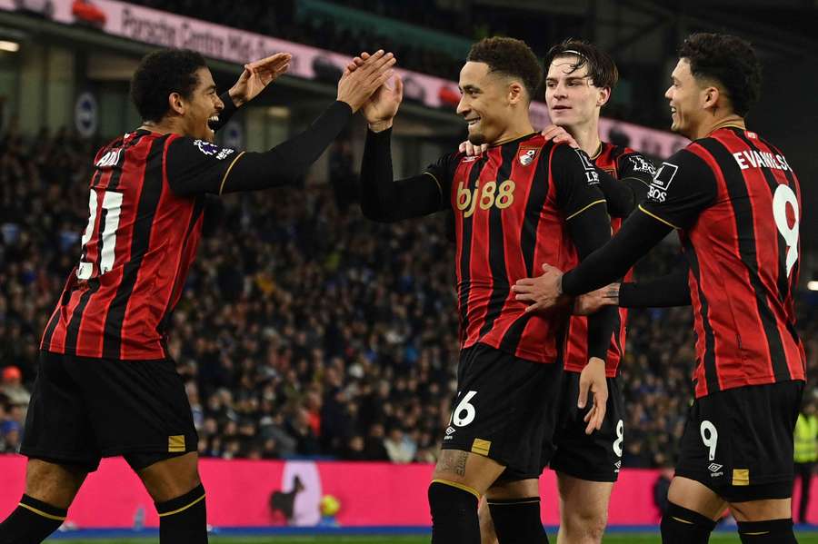 Marcus Tavernier celebrates with Amine Adli after scoring the opening goal of the match