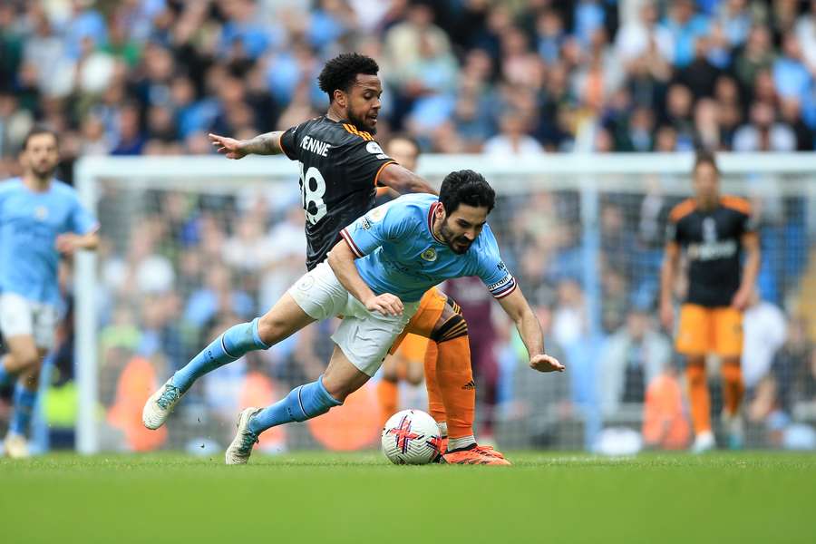 Ilkay Gundogan (front) is fouled by Leeds' Weston McKennie