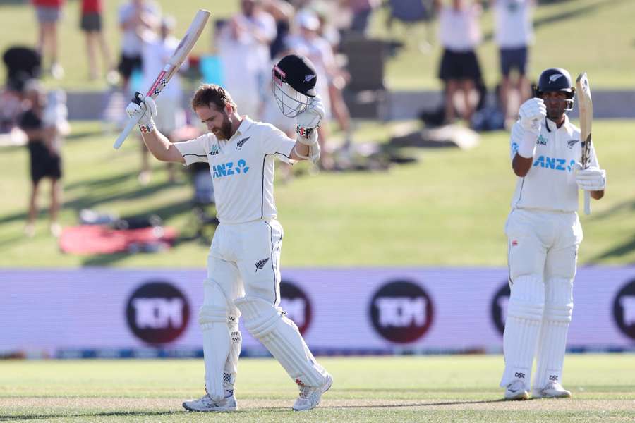 New Zealand’s Kane Williamson celebrates reaching a century during day one 