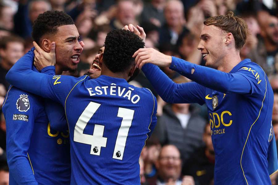 Chelsea's Morgan Rogers celebrates scoring their first goal with Cole Palmer, Estevao and Pedro Neto