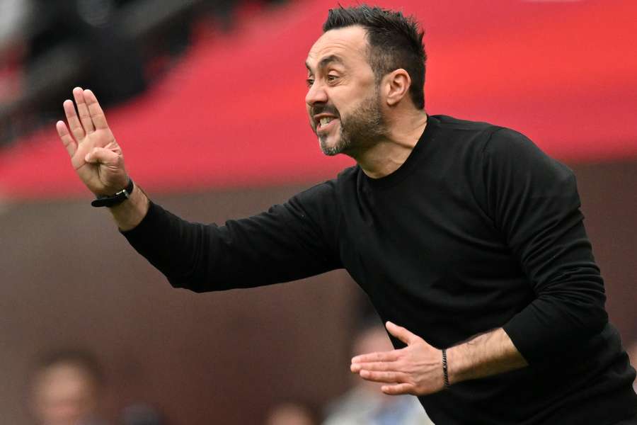 Brighton's Italian head coach Roberto De Zerbi reacts