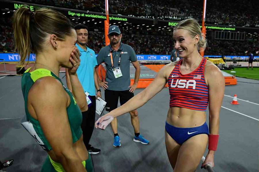 Australia's Nina Kennedy celebrates with USA's Katie Moon after they decided to share the pole vault gold medal on Wednesday