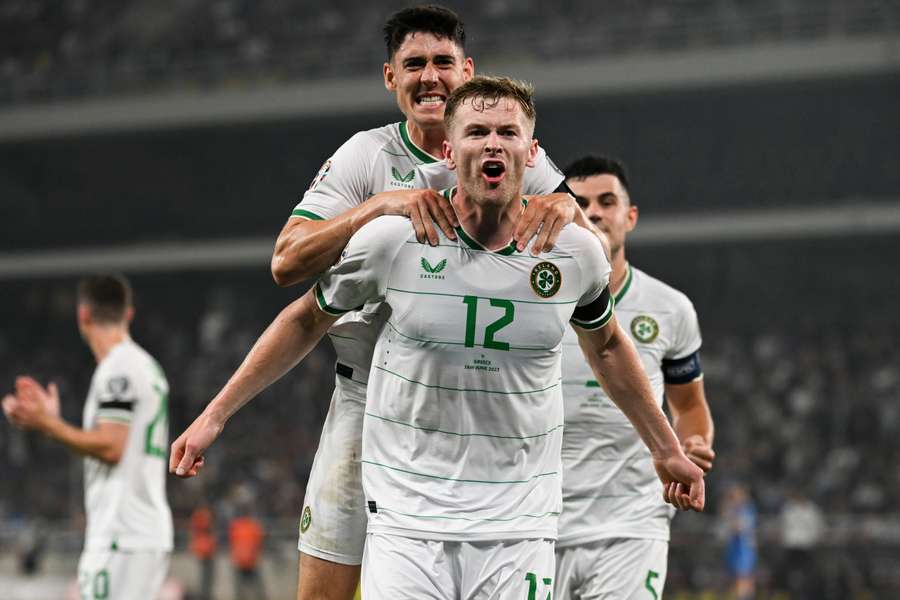 Ireland defender Nathan Collins (front) celebrates