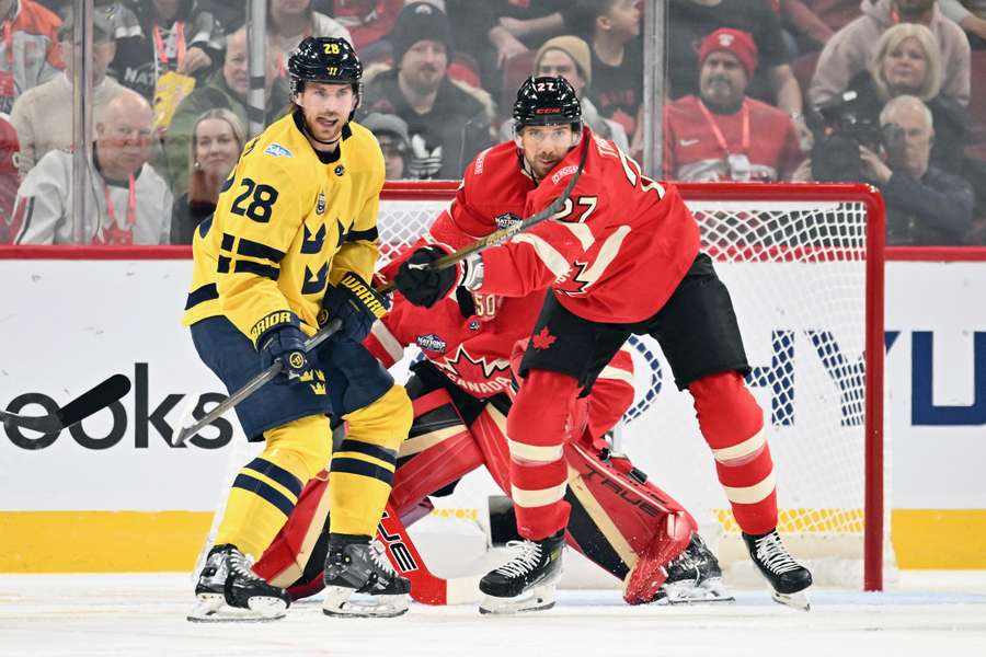 Sweden's Elias Lindholm and Canada's Shea Theodore battling in front of the net (February 12, 2025)