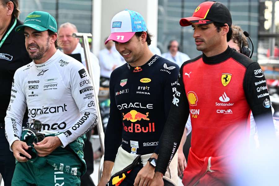 Aston Martin's Spanish driver Fernando Alonso, Red Bull Racing's Mexican driver Sergio Perez and Ferrari's Spanish driver Carlos Sainz Jr