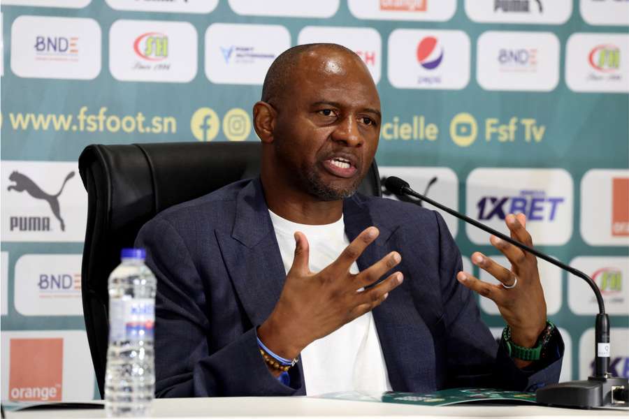 Patrick Viera speaks to the media