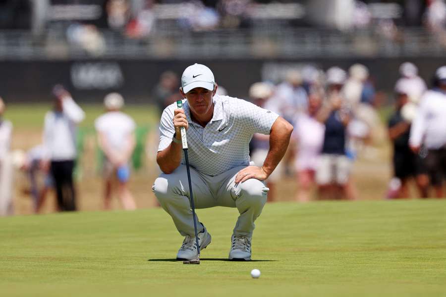 Rory McIlroy lines up his putt on the eighth hole during the final round 