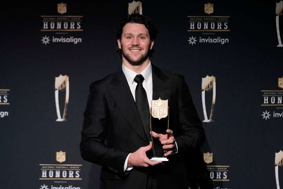 Josh Allen posing with the 2025 AP Most Valuable Player Award
