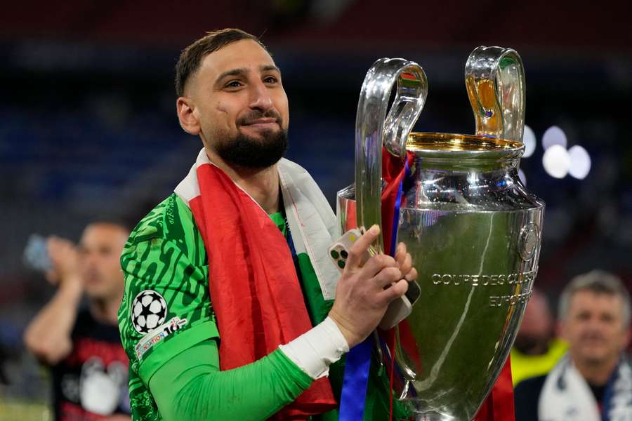 Gianluigi Donnarumma celebrates with the Champions League trophy after PSG beat Inter Milan in last season's final