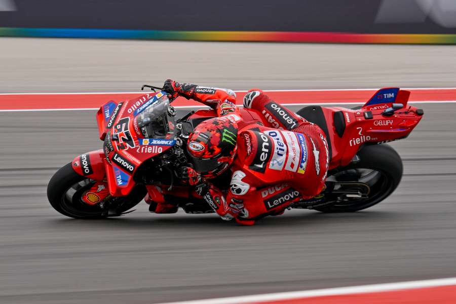 Francesco Bagnaia rides in warm-ups before the start