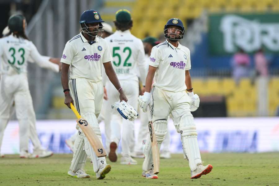 India's Sai Sudharsan (L) and Kuldeep Yadav walk back to the pavilion at the end of play on the fourth day