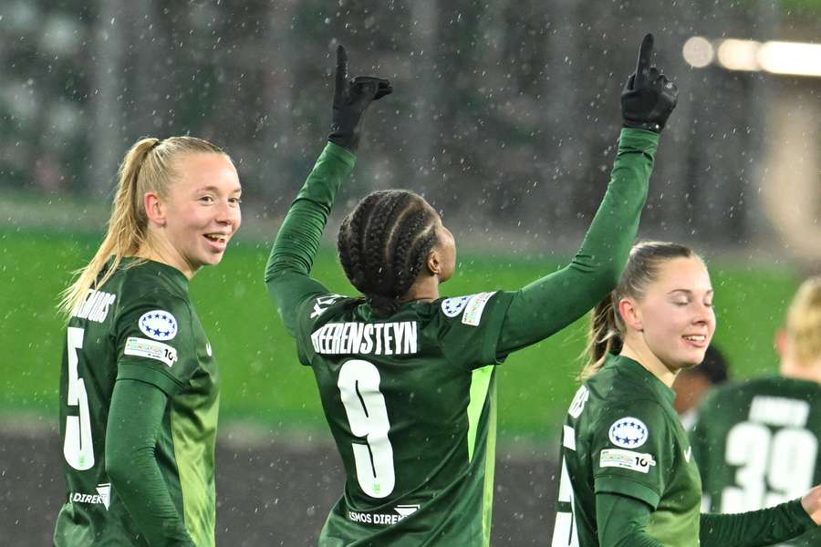 Wolfsburg's Ella Peddemors (L) and Lineth Beerensteyn after Beerensteyn's goal against Manchester United