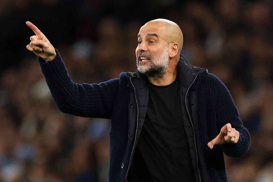 Pep Guardiola gives instructions during Man City's defeat on Sunday
