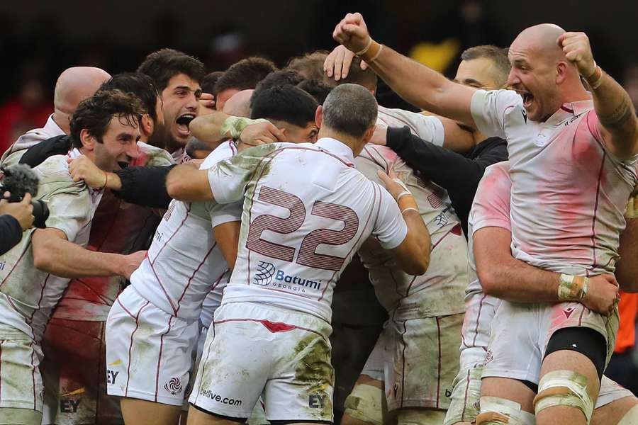 Georgia's players celebrate beating Cardiff after trailing at half-time.