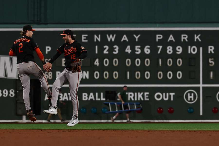 The Baltimore Orioles celebrate ending the Boston Red Sox's 15-game winning streak on Wednesday night.