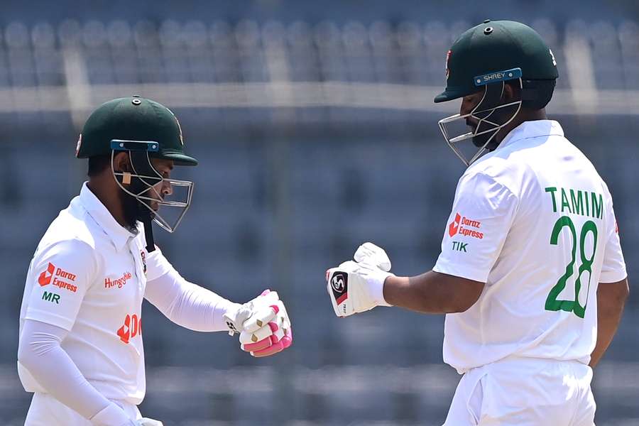 Bangladesh's Mushfiqur Rahim (L) bumps fist with Tamim Iqbal