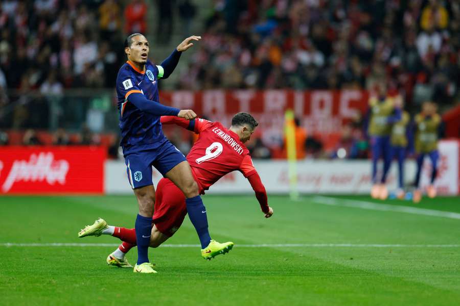 Virgil van Dijk battling Robert Lewandowski during Saturday's FIFA World Cup qualifier Virgil van Dijk battling Robert Lewandowski during Saturday's FIFA World Cup qualifier