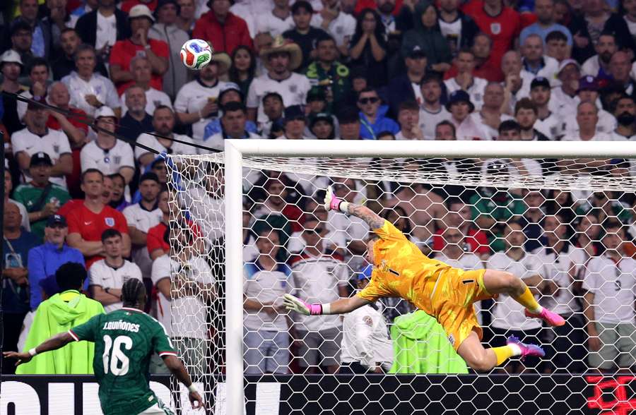 England's Jordan Pickford saves a shot by Mexico's Raul Jimenez