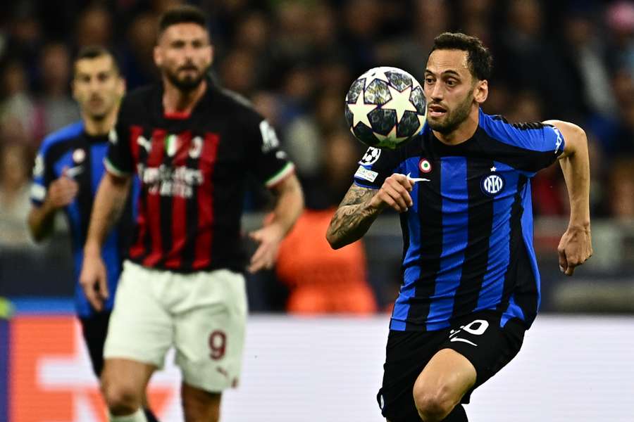 Hakan Calhanoglu runs with the ball