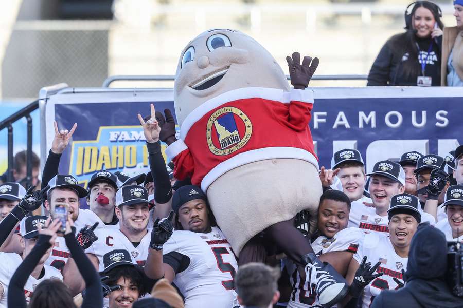 Northern Illinois football team celebrating their victory over Fresno State at the 2024 Famous Idaho Potato Bowl