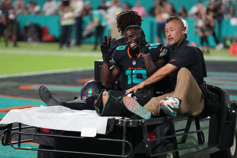 Tyreek Hill was seen smiling as he left the field on the cart