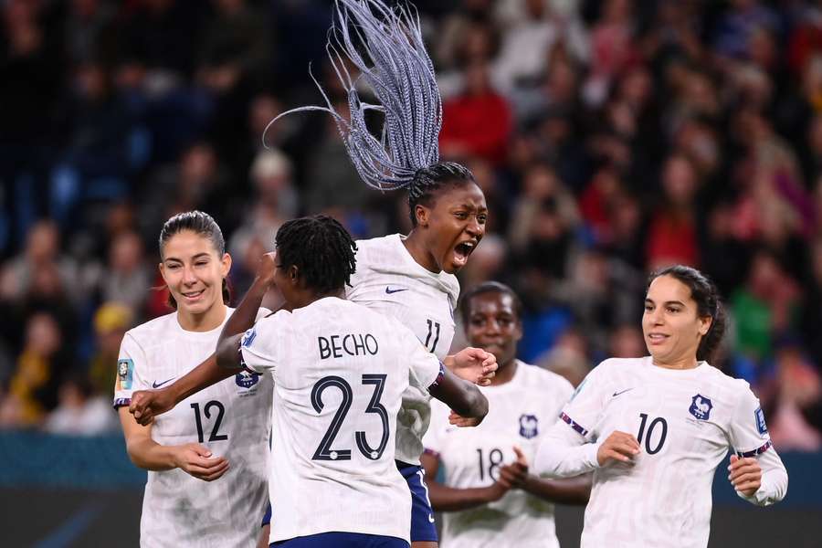 France's forward #11 Kadidiatou Diani celebrates after scoring