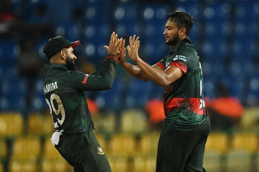 Shakib Al Hasan (R) celebrates