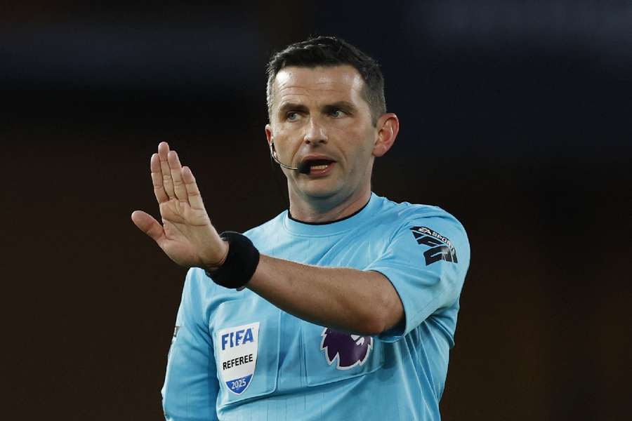 Michael Oliver during the match