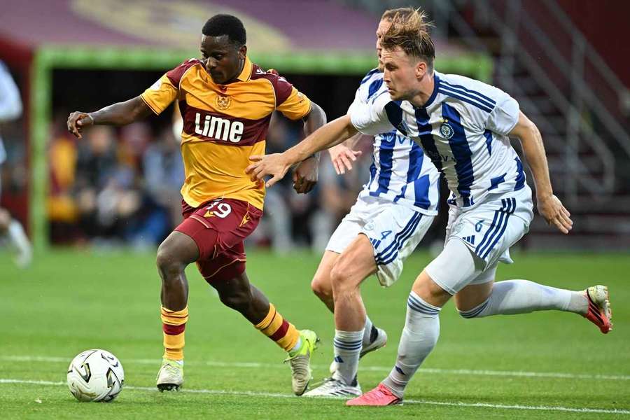 Ibrahim Said holds off HJK defenders