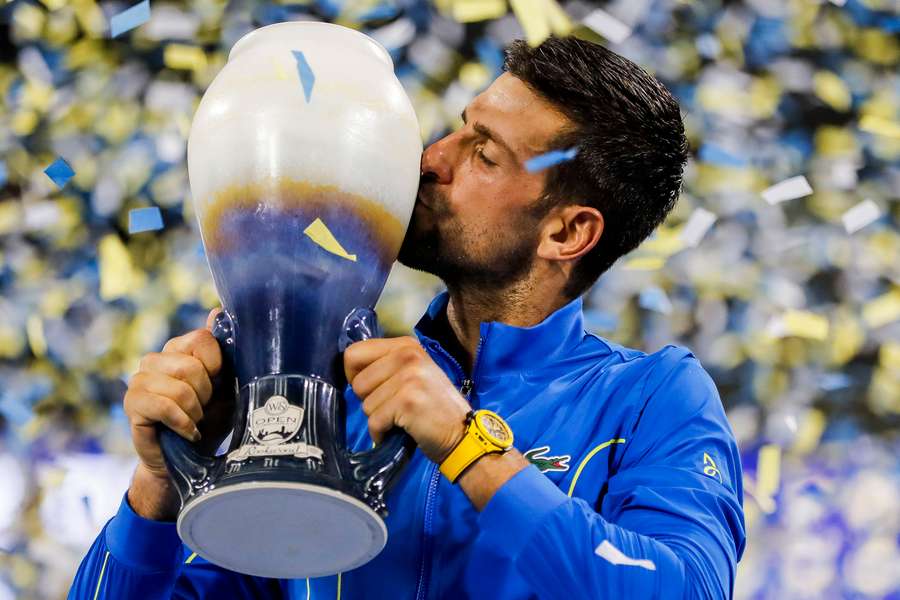 Djokovic kisses the Rookwood Cup after the victory over Alcaraz