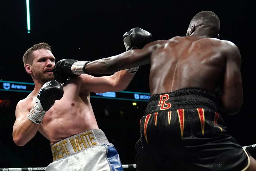 Light (L) takes a punch from Okolie