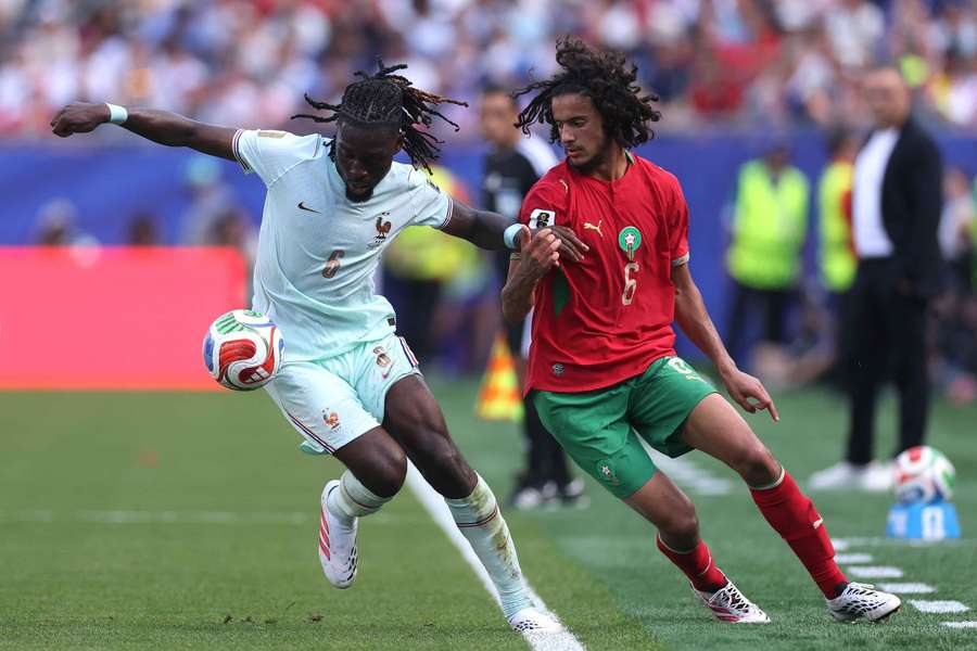 Morocco's Bouaddi (right) and France's Kone battle for the ball Morocco's Bouaddi (right) and France's Kone battle for the ball