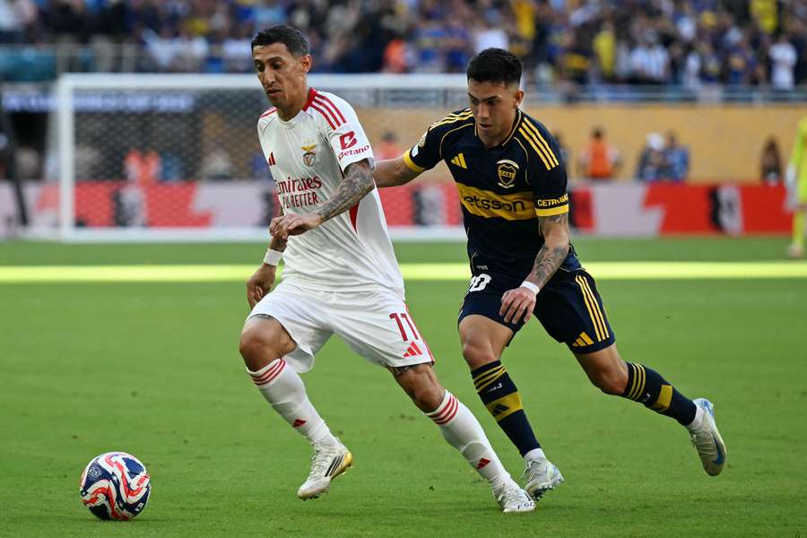 Benfica's Angel Di Maria and Boca's Alan Velasco fight for the ball during the 2025 FIFA Club World Cup
