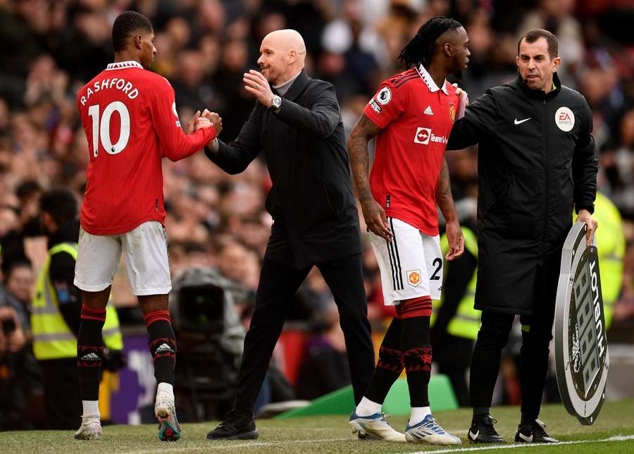 Marcus Rashford is congratulated by Manchester United's Dutch manager Erik ten Hag as he is substituted off