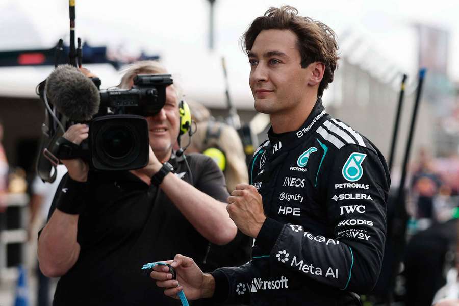George Russell celebrates after winning pole position for the sprint race in the Netherlands