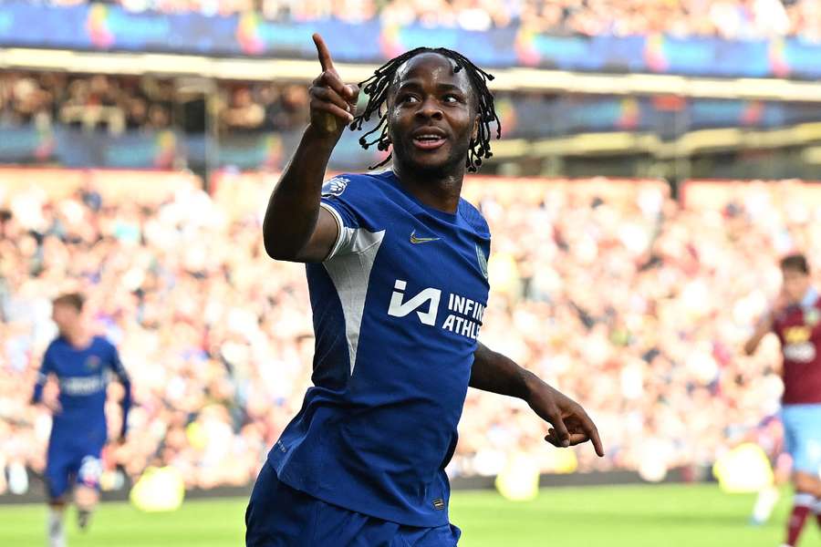 Raheem Sterling celebrates after scoring Chelsea's third goal against Burnley