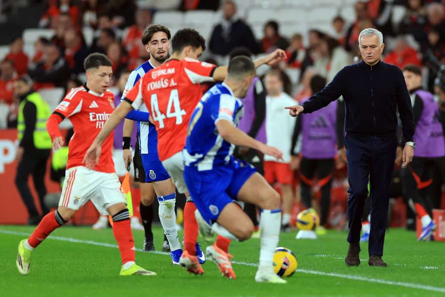 Tomas Araujo collects the ball in front of his manager Jose Mourinho