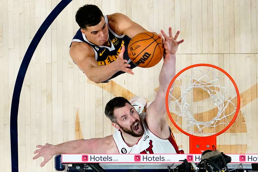  Miami Heat forward Kevin Love reaches for a loose ball against Denver Nuggets forward Michael Porter Jr