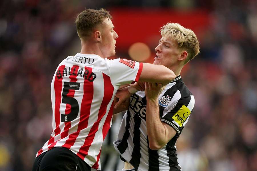 Sunderland's Dan Ballard and Newcastle United's Anthony Gordon clash.