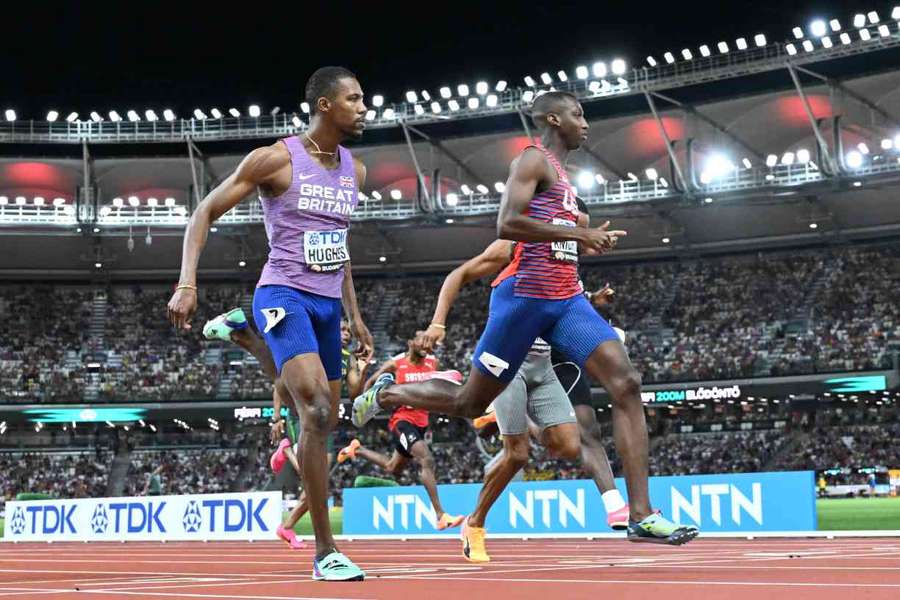 USA's Erriyon Knighton crosses the finish line ahead of Zharnel Hughes in the 200m semi-final