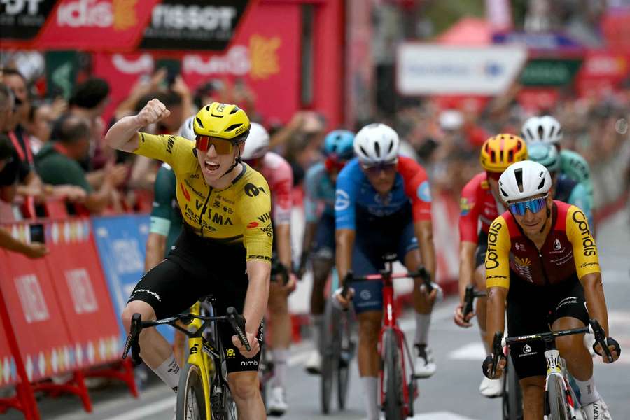 British rider Matthew Brennan (left) celebrates winning the 11th stage