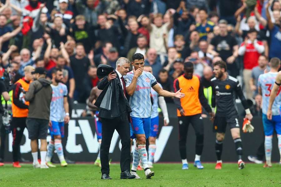 Solskjaer (L) brought Ronaldo back to the club in 2021