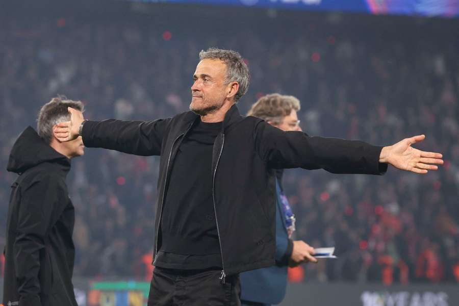 Luis Enrique takes the acclaim from PSG supporters after their win over Arsenal in the Champions League semi-final second leg. Luis Enrique takes the acclaim from PSG supporters after their win over Arsenal in the Champions League semi-final second leg.