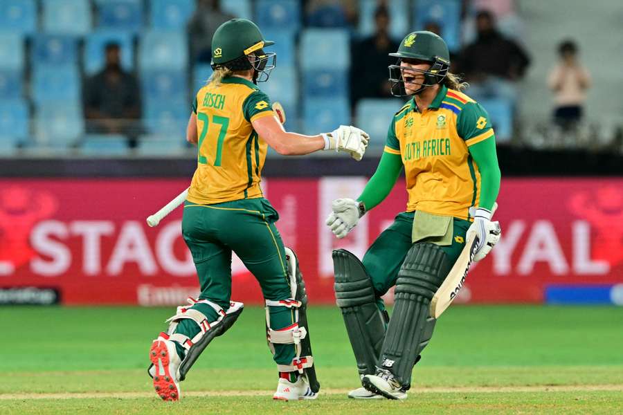 Anneke Bosch and Chloe Tryon celebrate their win at the end of the semi-final between Australia and South Africa