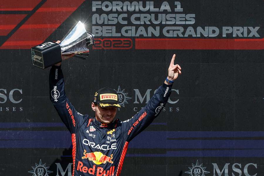 Red Bull's Max Verstappen celebrates with his trophy on the podium