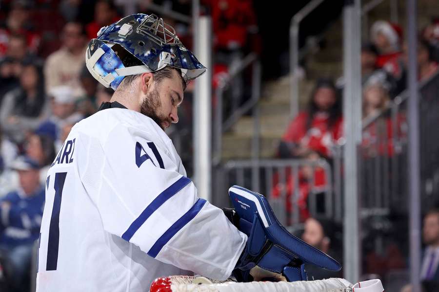 Toronto Maple Leafs goalie Anthony Stolarz taking a quick water break during a game against the New Jersey Devils