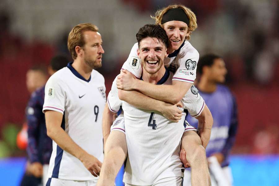 Declan Rice celebrates with teammate Anthony Gordon after England's 5-0 win over Serbia