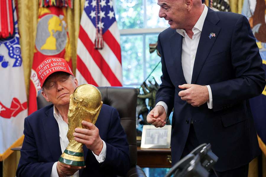 President Donald Trump holds the FIFA World Cup Trophy President Donald Trump holds the FIFA World Cup Trophy