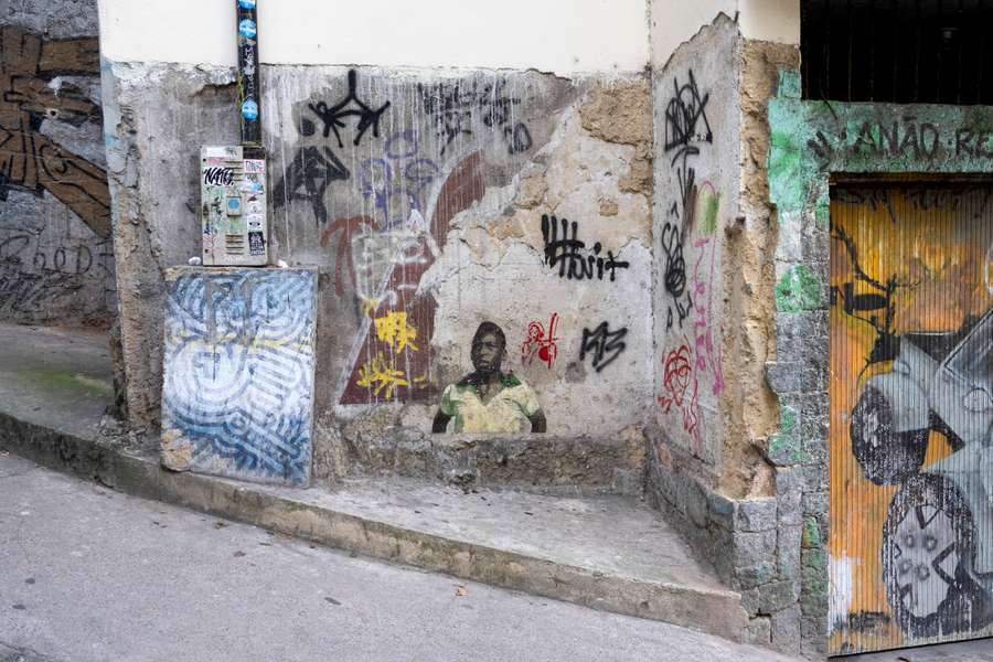 Street art depicting former Brazilian football star Pele is seen on a street leading into the Morro da Babilonia favela in Rio de Janeiro
