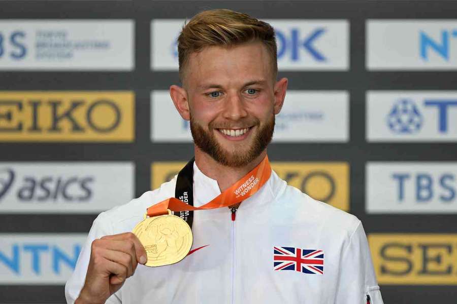 Josh Kerr receives his gold medal for winning the 1,500m on Wednesday